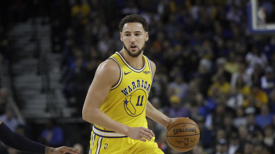 Golden State Warriors guard Klay Thompson (11) against the Denver Nuggets during an NBA basketball game in Oakland, Calif., Tuesday, April 2, 2019. (AP Photo/Jeff Chiu)