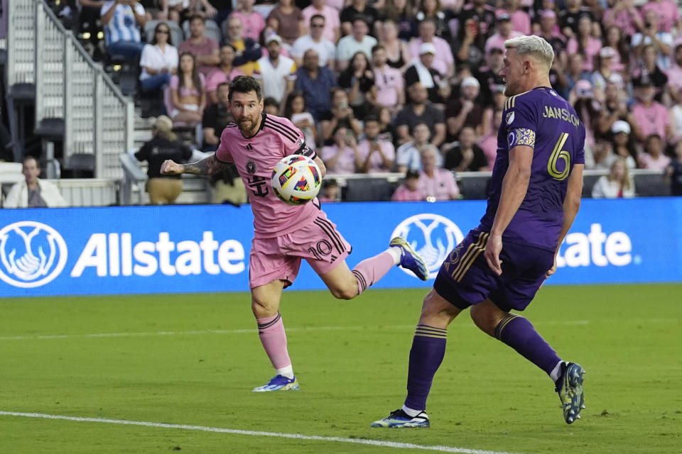 Inter Miami forward Lionel Messi (10) watches his header sail past Orlando City defender Robin Jansson (6) to score his side's fifth goal during the second half of an MLS soccer match, Saturday, March 2, 2024, in Fort Lauderdale, Fla. (AP Photo/Rebecca Blackwell)