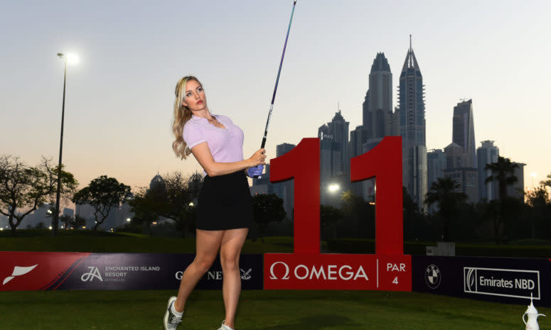 Paige Spiranac drives off the tee.