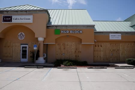 Stores with boarded up windows are seen ahead of the arrival of Hurricane Dorian in Cocoa Beach