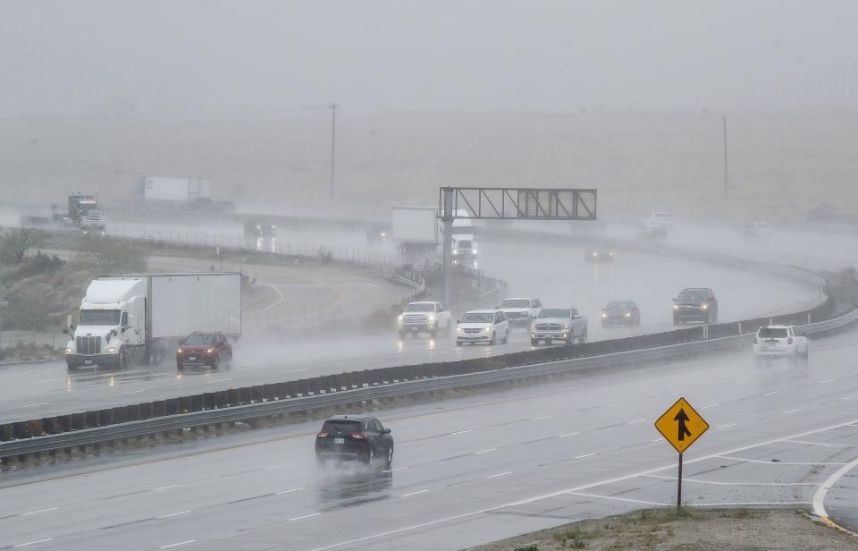Vehicles travel along Interstate 10 as rain falls near Haugen Lehmann Way in Whitewater, Calif., Feb. 5, 2024.