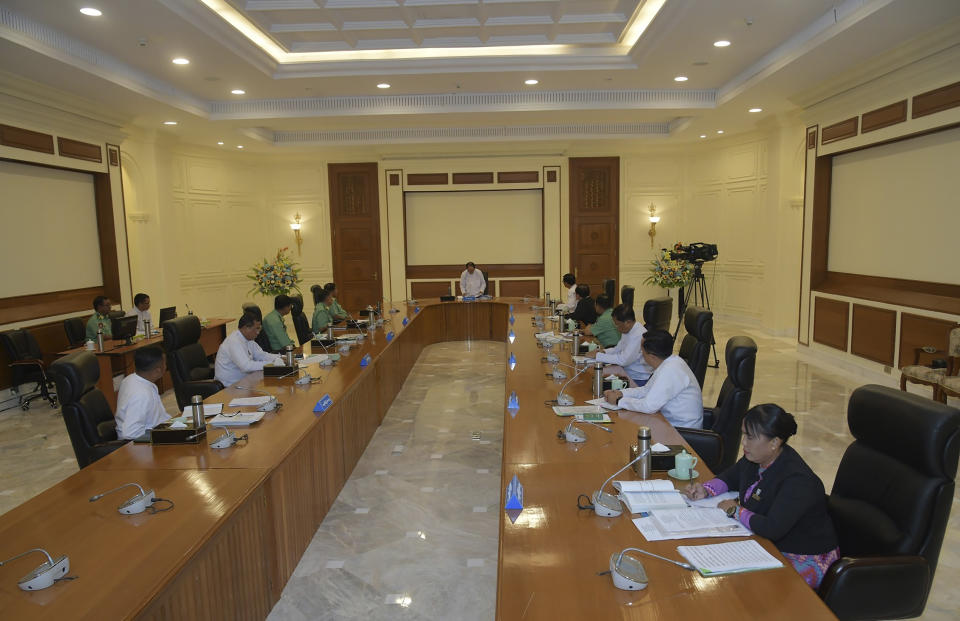 In this photo released from the The Military True News Information Team, Myint Swe, center, Pro Temporary President of the military government, speaks during a meeting with members the National Defense and Security Council including Senior Gen. Min Aung Hlaing, center left, chairman of State Administration Council, and Vice President Henry Van Thio, center right, Monday, July 31, 2023, in Naypyitaw, Myanmar. Myanmar’s military-controlled government has extended the state of emergency it imposed when the army seized power from an elected government 2 1/2 years ago, forcing a further delay in elections it promised when it took over. (The Military True News Information Team via AP)