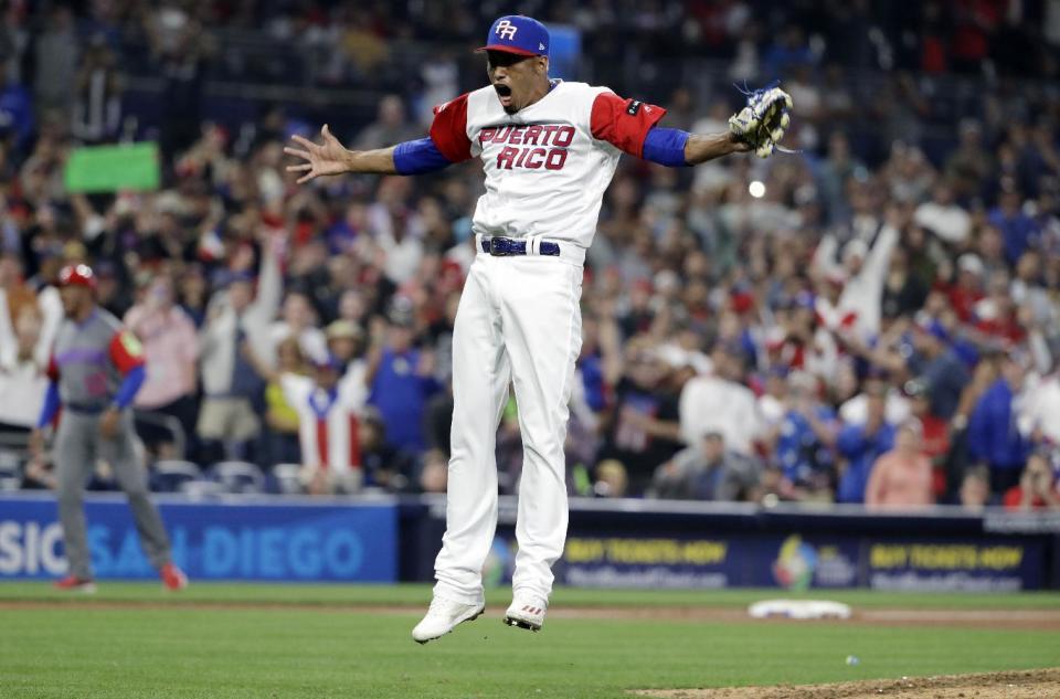 Puerto Rico pitcher Edwin Diaz reacts after getting the last out to defeat the Dominican Republic in a second-round World Baseball Classic game Tuesday, March 14, 2017, in San Diego. Puerto Rico won, 3-1. (AP Photo/Gregory Bull)