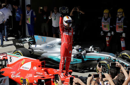 Formula One F1 - Brazilian Grand Prix 2017 - Sao Paulo, Brazil - November 12, 2017 Ferrari's Sebastian Vettel celebrates winning the race REUTERS/Paulo Whitaker