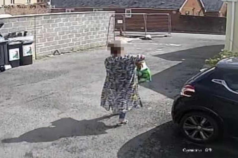 The woman heads to the car. (Wales News)