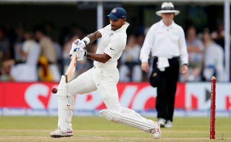 Cricket - Sri Lanka v India - First Test Match - Galle, Sri Lanka - July 26, 2017 - India's cricketer Shikhar Dhawan plays a shot. REUTERS/Dinuka Liyanawatte