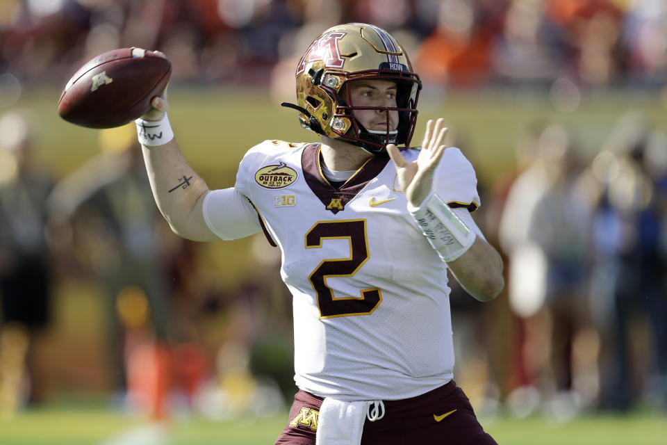 FILE - In this Wednesday, Jan. 1, 2020, file photo, Minnesota quarterback Tanner Morgan (2) throws a pass against Auburn during the first half of the Outback Bowl NCAA college football game, in Tampa, Fla. The Big Ten will start playing football at what normally would be midseason. The coronavirus pandemic limited or eliminated most spring practices. Positive COVID-19 tests and precautions, along with uncertainty about whether there would even be a season, caused disruptions in summer workouts and preseason practices. (AP Photo/Chris O'Meara, File)