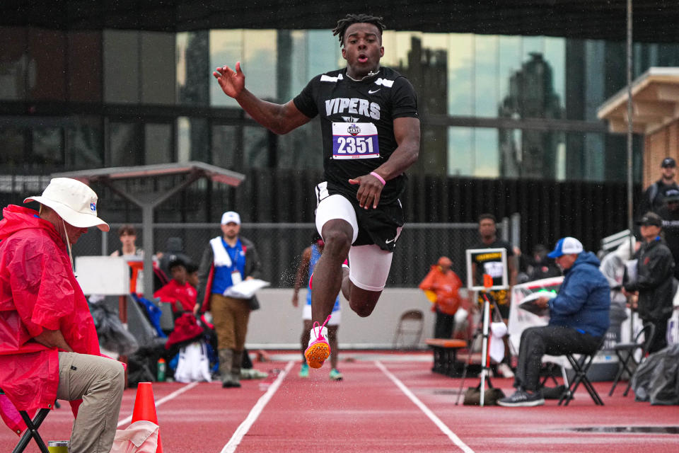 Vandegrift's Miles Coleman goes airborne in the long jump Saturday at the state meet.