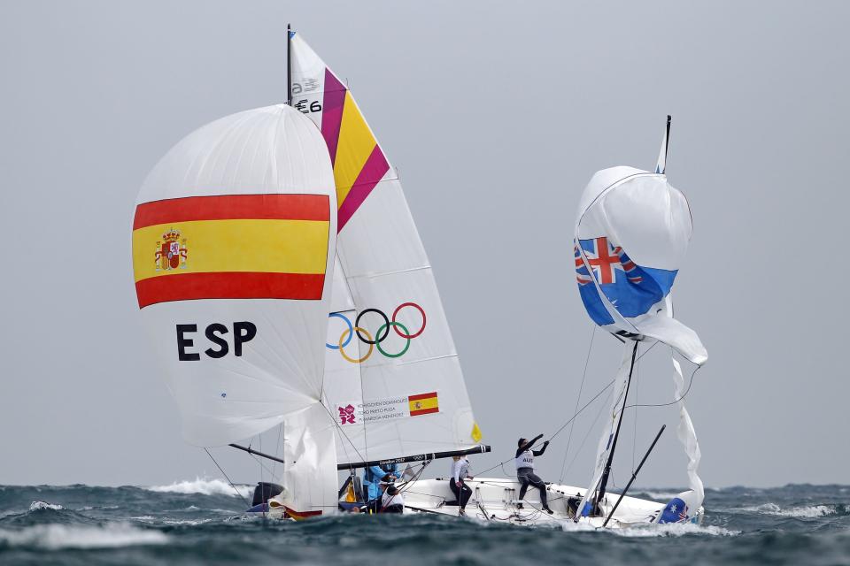 Spain's and Australia's competitors sail during the women's Elliott 6m medal race at the London 2012 Olympic Games in Weymouth and Portland, southern England, August 11, 2012. REUTERS/Benoit Tessier (BRITAIN - Tags: SPORT YACHTING OLYMPICS TPX IMAGES OF THE DAY) 