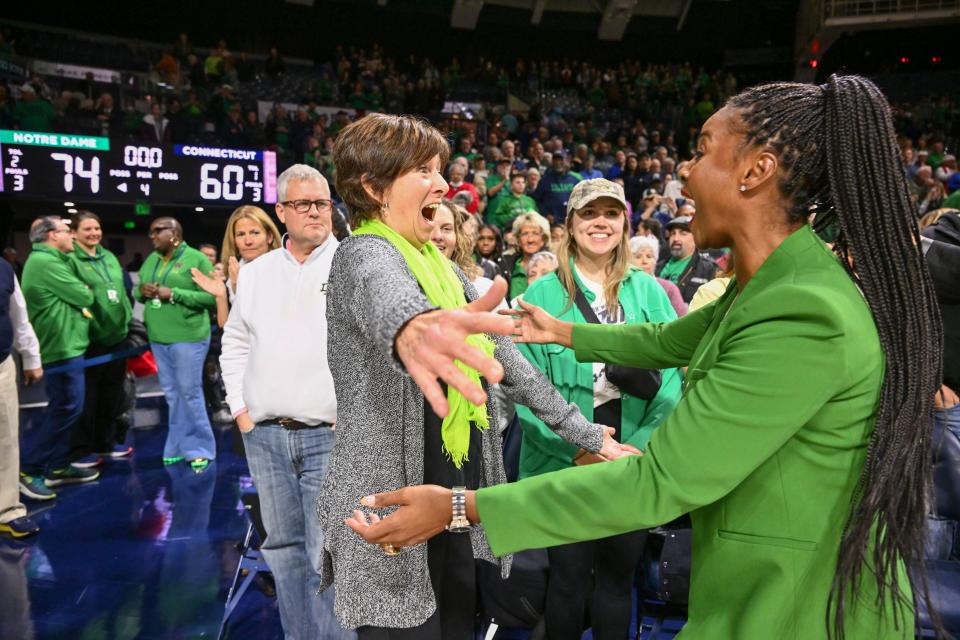 Dec 4, 2022; South Bend, Indiana, USA; Former Notre Dame coach Muffet McGraw, left, embraces Notre Dame Fighting Irish head coach Niele Ivey after Notre Dame defeated the Connecticut Huskies 74-60 at the Purcell Pavilion. Mandatory Credit: Matt Cashore-USA TODAY Sports