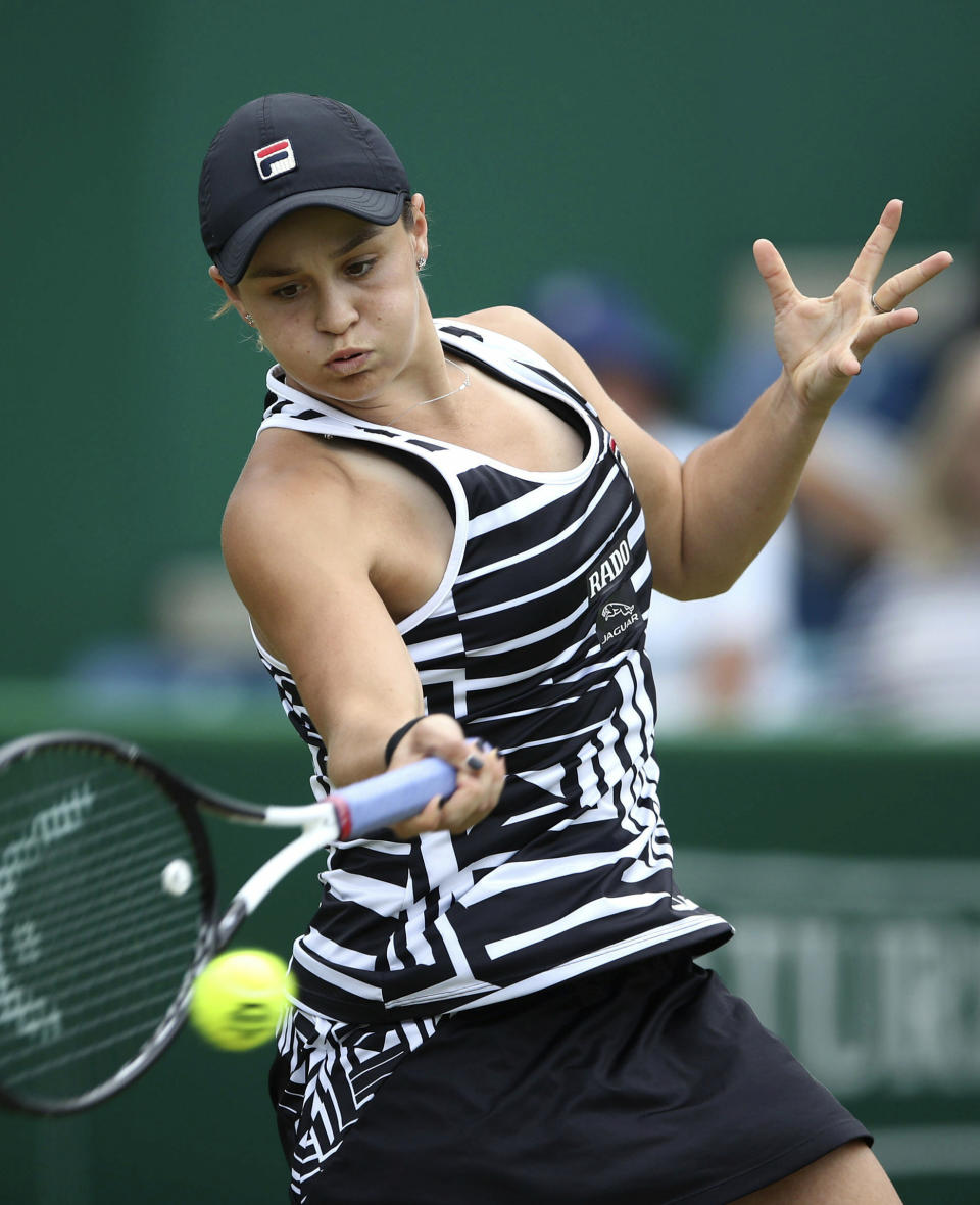 Australia's Ashley Barty in action against Germany's Julia Goerges during the final match of the Nature Valley Classic at Edgbaston Priory Club in Birmingham, England, Sunday June 23, 2019. Barty went on to win the match. (Tim Goode/PA via AP)