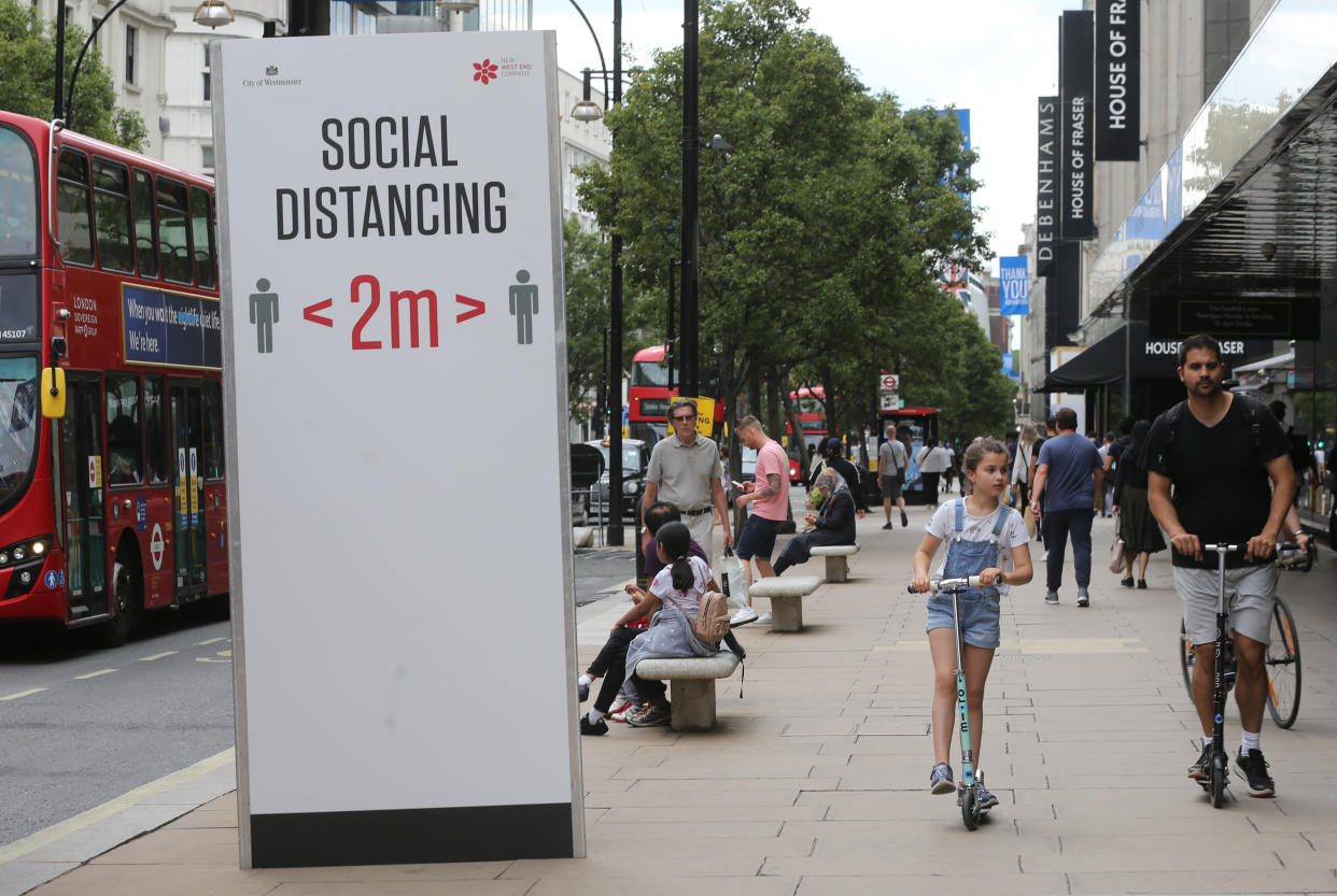 A social distancing sign telling people to adhere to social distancing and stay two metres apart on Oxford Street, London, as non-essential shops in England open their doors to customers for the first time since coronavirus lockdown restrictions were imposed in March. Picture date: Monday June 15, 2020.