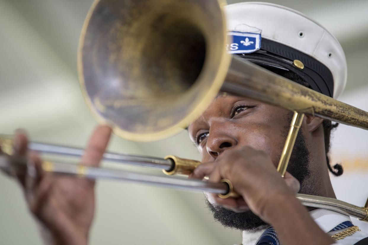 The Paulin Brothers Brass Band performs at the New Orleans Jazz & Heritage Festival on Friday.