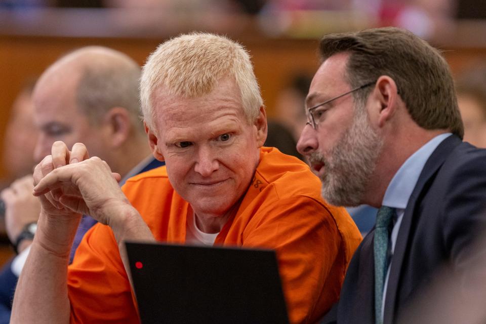 Alex Murdaugh, left, confers with Phil Barber during a judicial hearing at the Richland County Judicial Center in Columbia, S.C., Monday, Jan. 29, 2024. (Tracy Glantz/The State via AP, Pool) ORG XMIT: SCCOL101