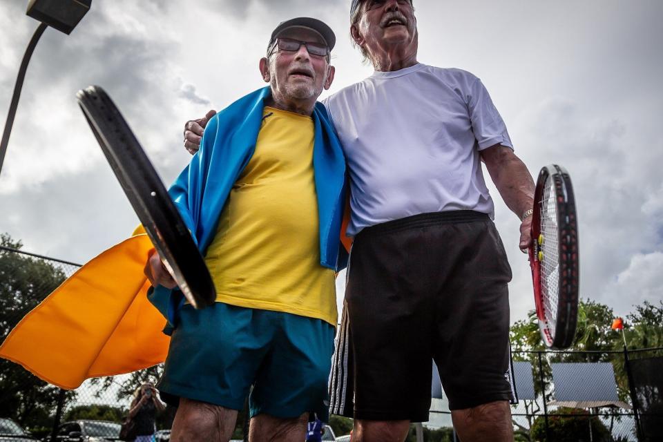 Ukrainian refugee Leonid Stanislavskyi, 98, poses with George McCabe, 90, Oxford, Ohio after their match during men's singles action at the ITF Super Seniors World Tennis Championships at Coral Lakes Tennis Center in Boynton Beach, Monday. The men are competing in over-90 division.
