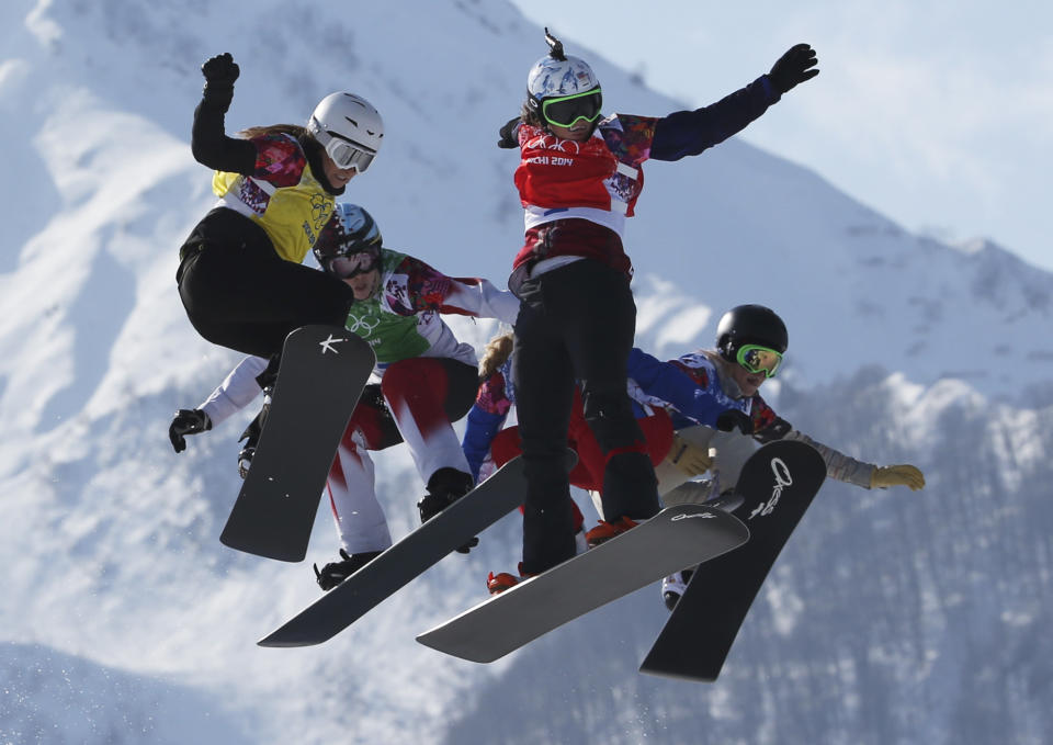 Czech Republic's Eva Samkova, second right, leads the field in the women's snowboard cross final at the Rosa Khutor Extreme Park, at the 2014 Winter Olympics, Sunday, Feb. 16, 2014, in Krasnaya Polyana, Russia. Samkova went on to win the gold medal. The other boarders are, from left, Bulgaria's Alexandra Jekova, Canada's Dominique Maltais, France's Chloe Trespeuch (obscured), and United States' Faye Gulini. (AP Photo/Luca Bruno)