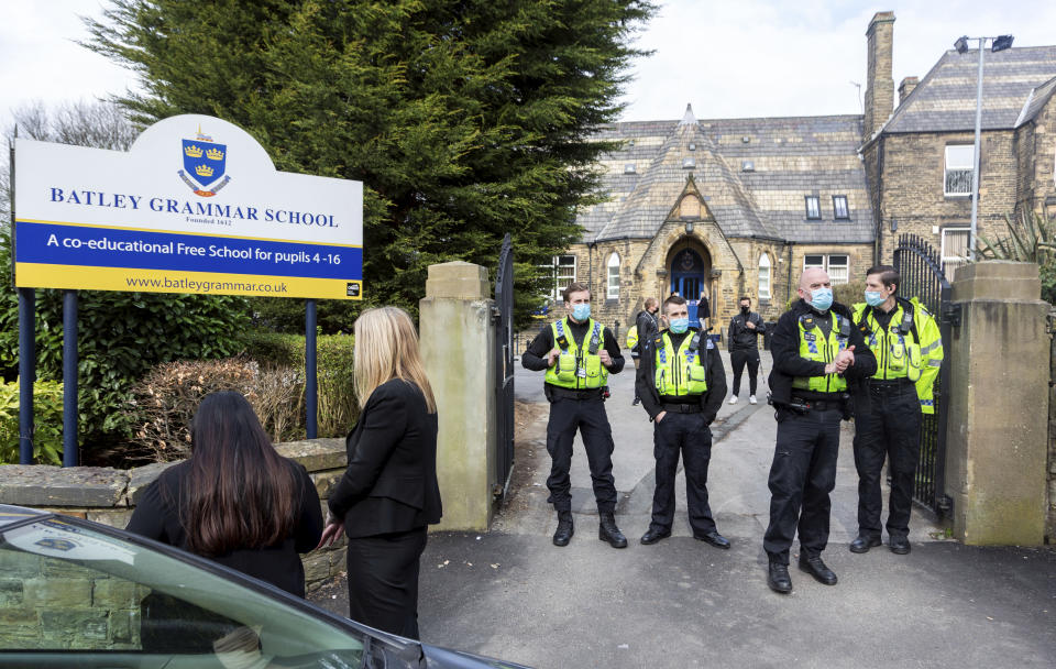 Police have been at Batley Grammar School since the protests started. (SWNS)