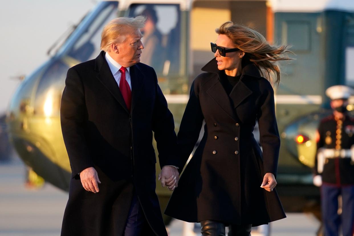 <p>President Donald Trump and first lady Melania Trump walk to board Air Force One at Andrews Air Force Base, Md., Wednesday to travel to Mar-a-Lago</p> (AP)