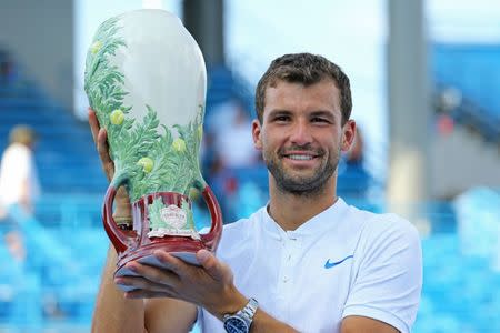 Aug 20, 2017; Mason, OH, USA; Grigor Dimitrov (BUL) holds the Rookwood Cup after defeating Nick Kyrgios (AUS) in the finals during the Western and Southern Open at the Lindner Family Tennis Center. Aaron Doster-USA TODAY Sports