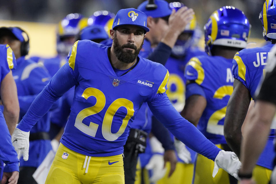 Los Angeles Rams defensive back Eric Weddle (20) congratulates teammates during the second half of an NFL wild-card playoff football game against the Arizona Cardinals in Inglewood, Calif., Monday, Jan. 17, 2022. (AP Photo/Mark J. Terrill)