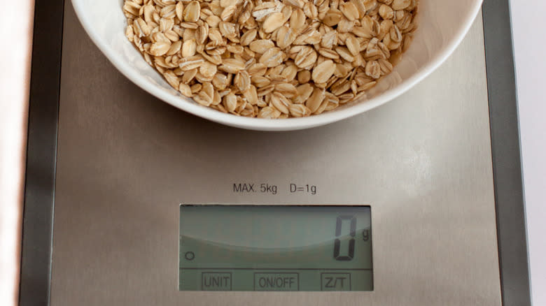 kitchen scale with oats at zero