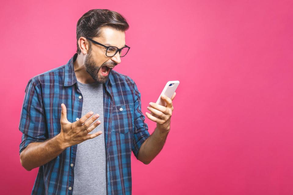 Man shouting at mobile phone