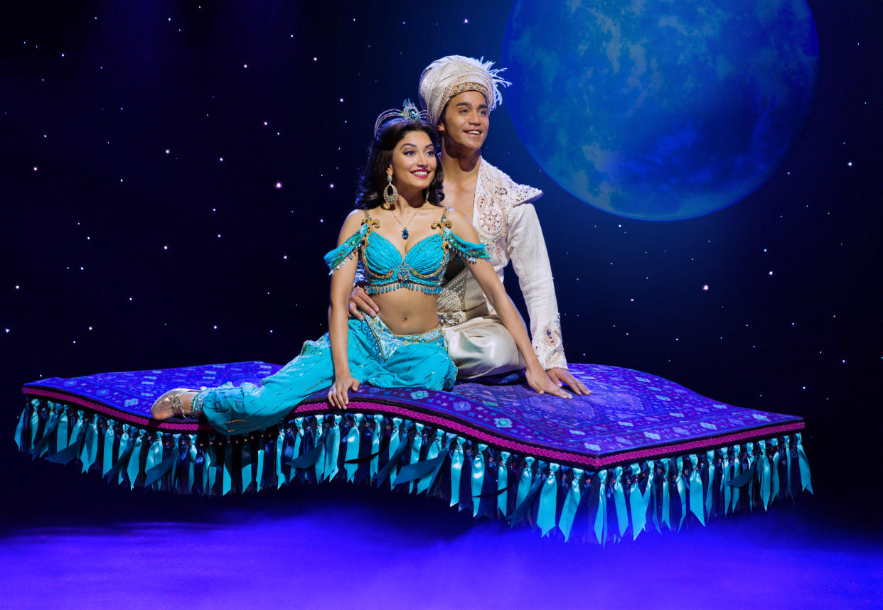 Shubshri Kandiah as Jasmine and Graeme Isaako as Aladdin with the flying carpet in Disney's Aladdin musical. (Photo: Disney)