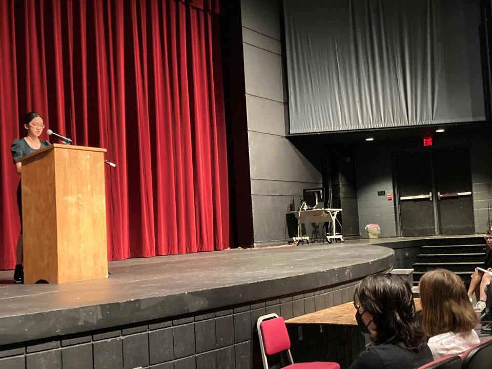 Olivia Feng, 14, reads Maya Angelou's poem "Equality" followed by her original piece about gender equality and wage gaps at Appleton North High School auditorium on May 26.