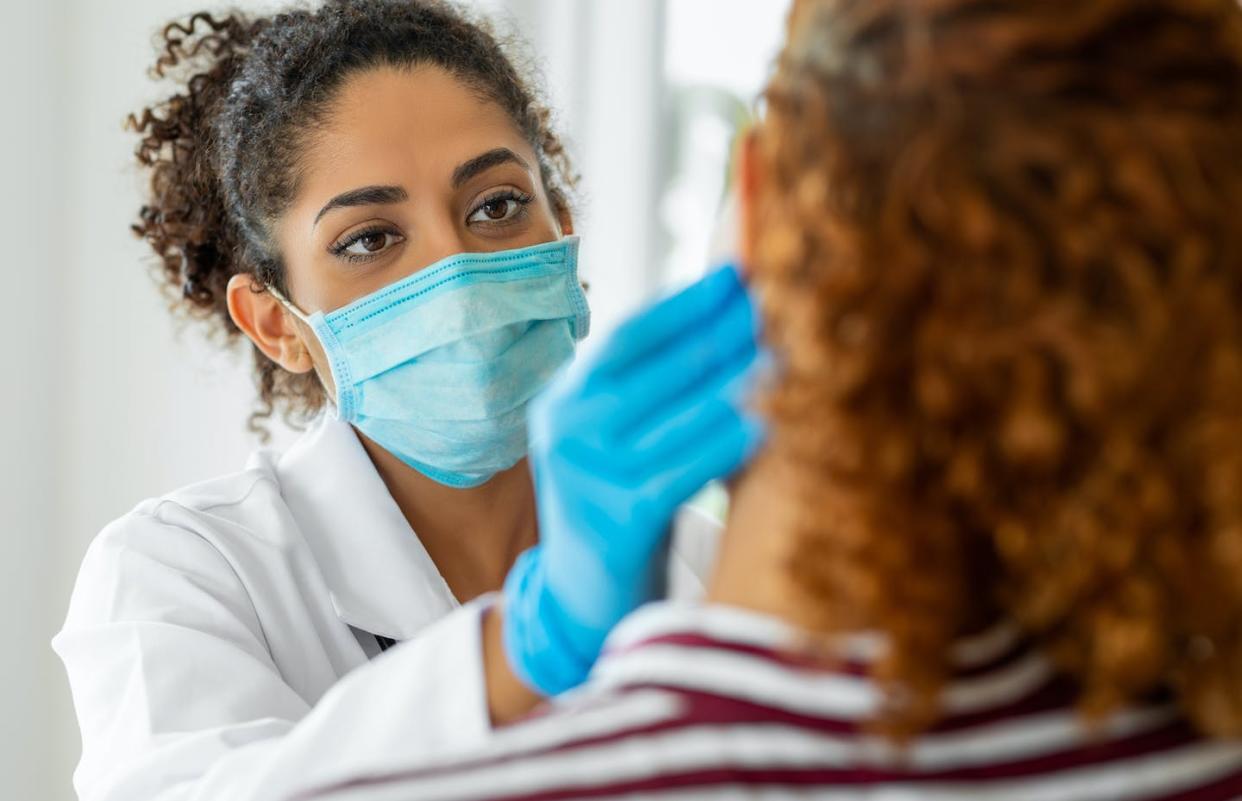 Growth outpaced new enrollment from the Affordable Care Act's Medicaid expansion. <a href="https://www.gettyimages.com/detail/photo/doctor-wearing-surgical-mask-examining-royalty-free-image/1349349174" rel="nofollow noopener" target="_blank" data-ylk="slk:bymuratdeniz/E+via Getty Images;elm:context_link;itc:0;sec:content-canvas" class="link ">bymuratdeniz/E+via Getty Images</a>