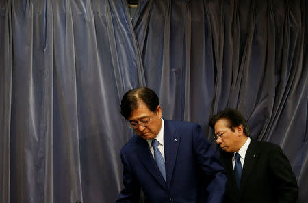 Mitsubishi Motors Corp's CEO Osamu Masuko (L) and President Tetsuro Aikawa arrive at a news conference in Tokyo, Japan, May 11, 2016. REUTERS/Toru Hanai