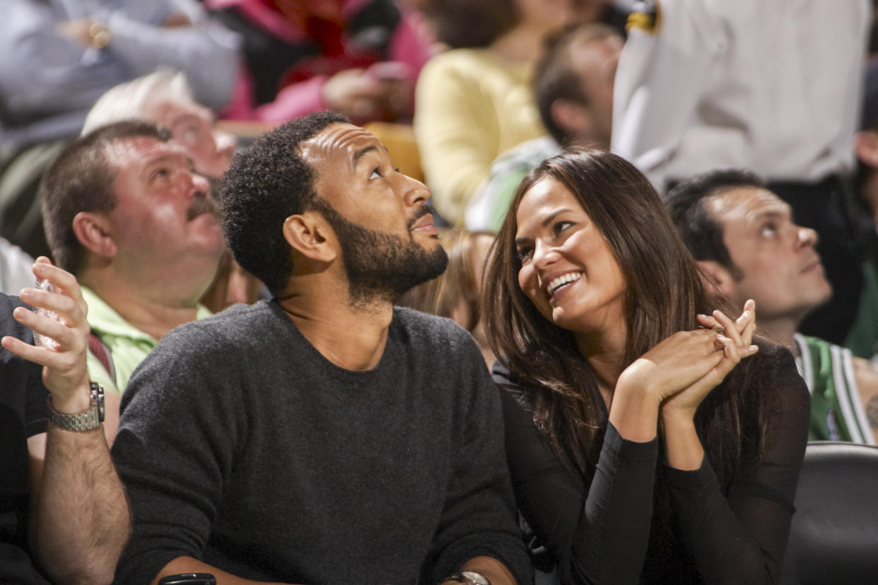 Image: John Legend with girlfriend and Sports Illustrated Swimsuit model Christine Teigen during a Boston Celtics vs Cleveland Cavaliers game on May 9, 2010 in Boston. (Damian Strohmeyer / Sports Illustrated via Getty Imaes)