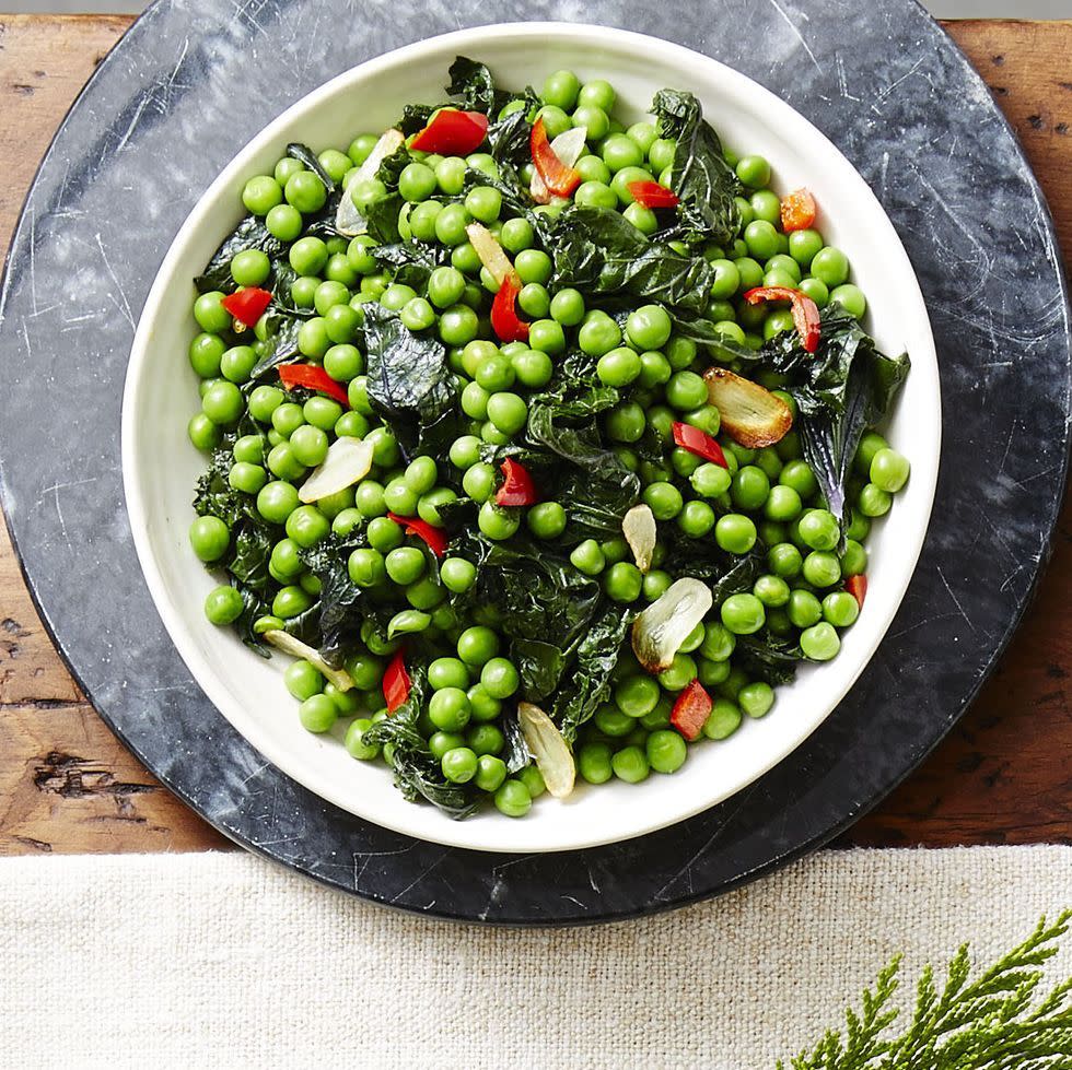 garlicky kale pea sauté in a white bowl
