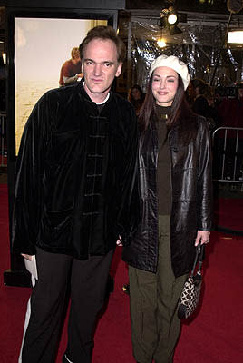 Quentin Tarantino with gal at the Mann National Theater premiere of Dreamworks' The Mexican