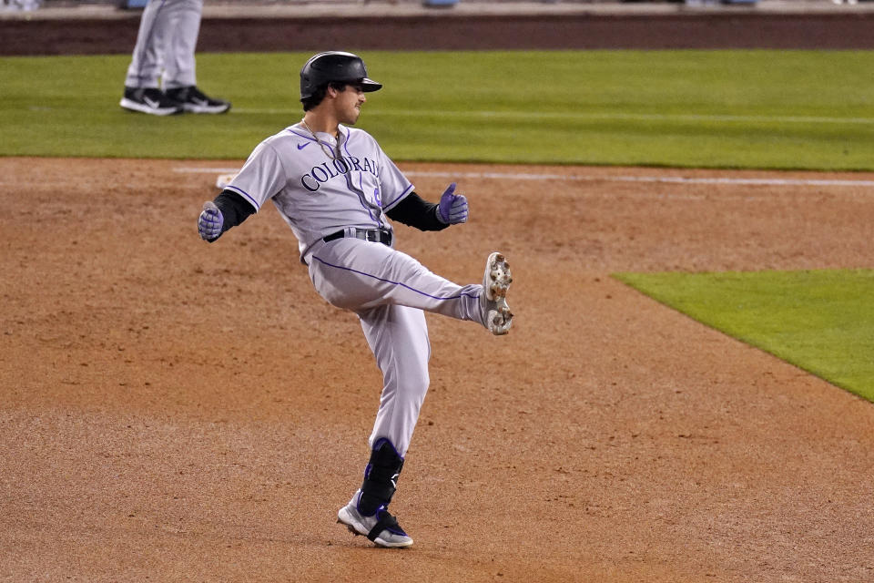 Colorado Rockies' Josh Fuentes reacts after Los Angeles Dodgers center fielder Mookie Betts made a catch on his fly ball to end the top sixth inning of a baseball game Wednesday, April 14, 2021, in Los Angeles. (AP Photo/Mark J. Terrill)