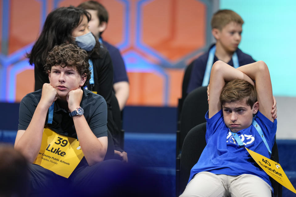 Luke Brown, 14, from Naples, Fla., left, and Evander Turner, 14, from Clermont, Fla., wait to compete during the Scripps National Spelling Bee, Tuesday, May 30, 2023, in Oxon Hill, Md. (AP Photo/Alex Brandon)