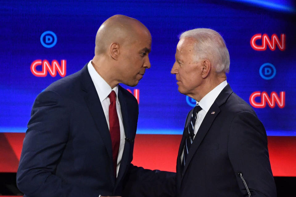 Democratic presidential hopefuls Former Vice President Joe Biden (R) and US Senator from New Jersey Cory Booker chat during a break in the second round of the second Democratic primary debate of the 2020 presidential campaign season hosted by CNN at the Fox Theatre in Detroit, Michigan on July 31, 2019. | Jim Watson—AFP/Getty Images