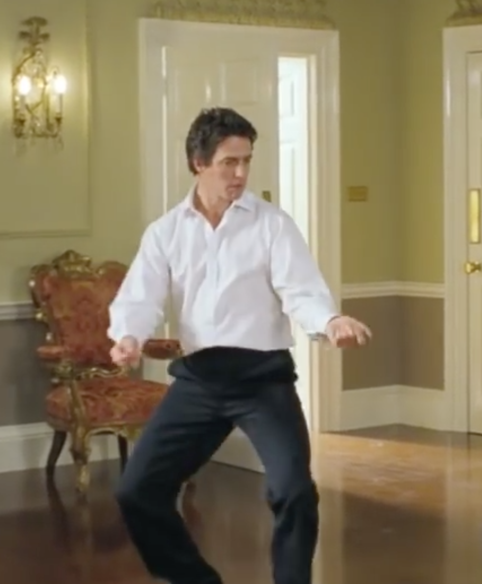 We’re having major “Love Actually” flashbacks watching Hugh Grant dance to “Hotline Bling”