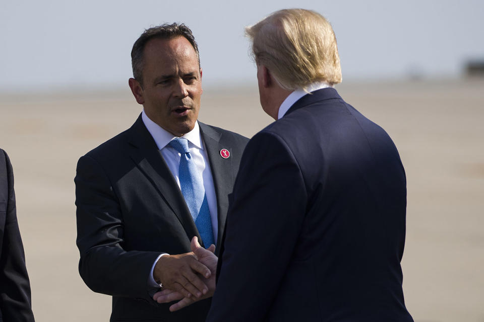 Gov. Matt Bevin, R-Ky., greets President Donald Trump as he steps off Air Force One as he arrives at Cincinnati/Northern Kentucky International Airport, Thursday, Aug. 1, 2019, in Hebron, Ky., to speak at a campaign rally in Cincinnati. 