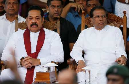 Sri Lanka's newly appointed Prime Minister Mahinda Rajapaksa and President Maithripala Sirisena look on during a rally near the parliament in Colombo, Sri Lanka November 5, 2018. REUTERS/Dinuka Liyanawatte/Files