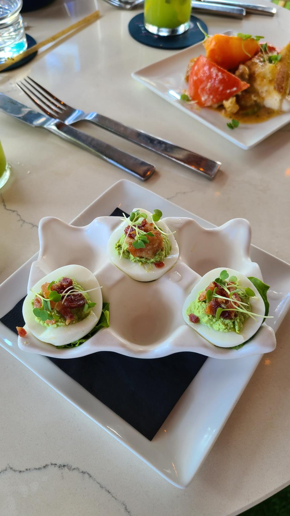 The 239's "Green Goddess" deviled eggs with candied bacon.