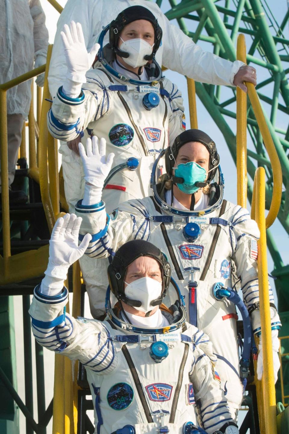 NASA's Kate Rubins, center, with Sergey Ryzhikov and Sergey Kud-Sverchkov (AP)