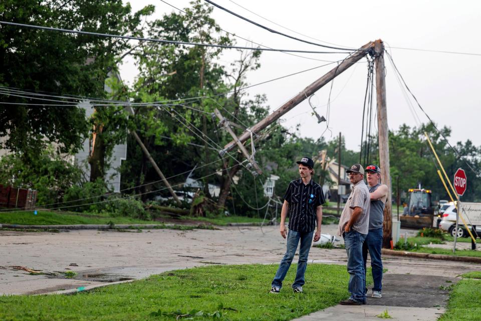 Claremore, Oklahoma residents survey storm damage on Sunday. Now, the deadly storms that struck the central US are heading for the east coast on Monday (AP)