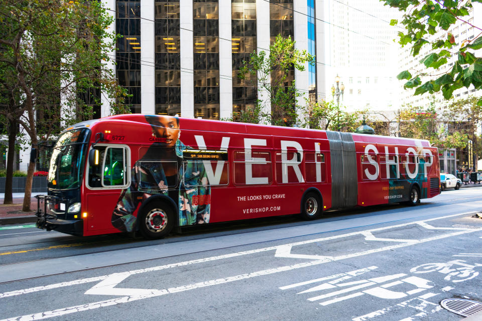 San Francisco, California, USA - Circa, 2019 : Retail online-shopping website Verishop advertisement on MUNI bus on city street. Verishop is a new e-commerce site that sells a curated selection of women's and men's fashion, home goods, and beauty products.