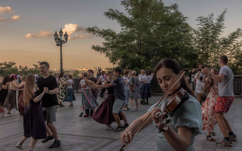 People perform Ukrainian folk dance at Saint Volodymyr Hill in downtown Kyiv