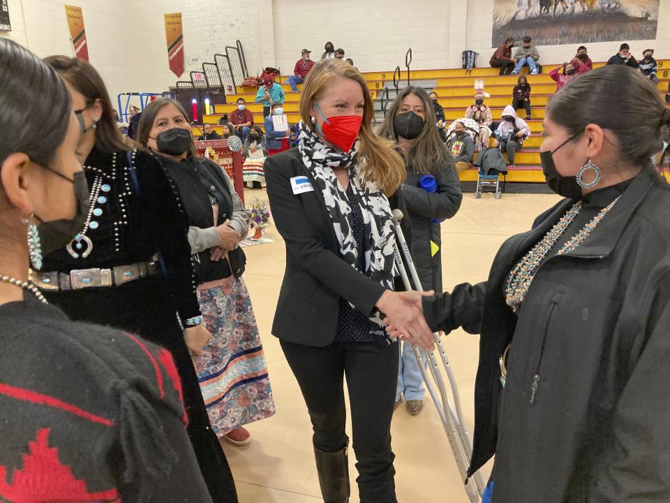 This Feb. 17, 2023 image shows U.S. Rep. Melanie Stansbury of New Mexico, center, meeting with community members in To'Hajiilee, New Mexico. To'Hajiilee Community School is just one of dozens funded by the U.S. Bureau of Indian Education that are in desperate need of repair or replacement. The agency estimates it would cost roughly $6.2 billion to address the needs of those schools in poor condition. (AP Photo/Susan Montoya Bryan)