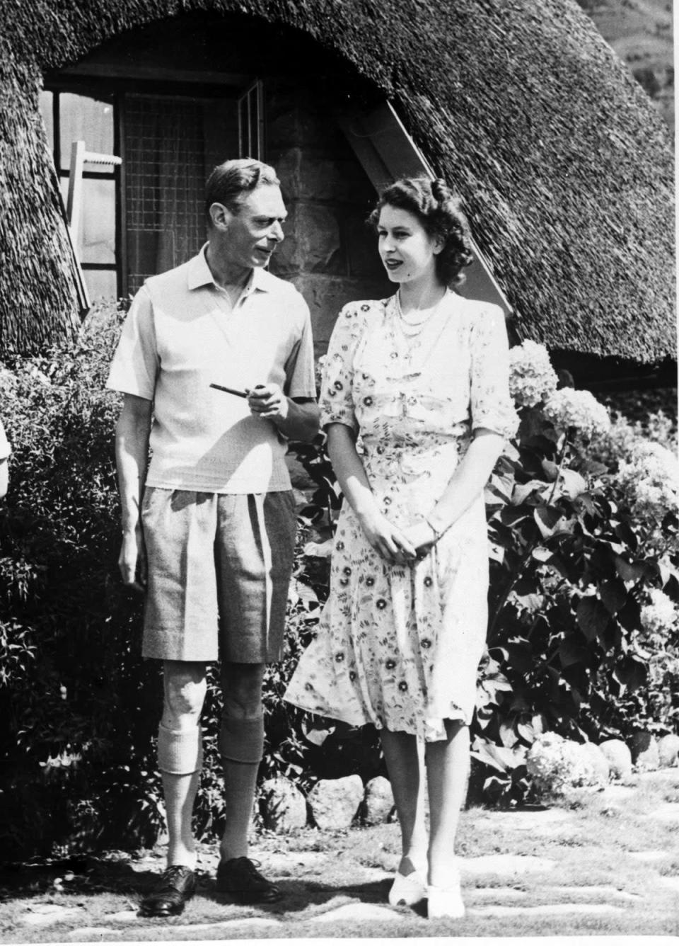 File photo dated 21/04/47 of King George VI relaxing with his daughter Princess Elizabeth during a visit to Natal National Park in South Africa. The Queen is set to enter the milestone 70th year of her reign, as she prepares to mark the anniversary of her accession away from Sandringham for the first time in more than 30 years. Issue date: Friday February 5, 2021.