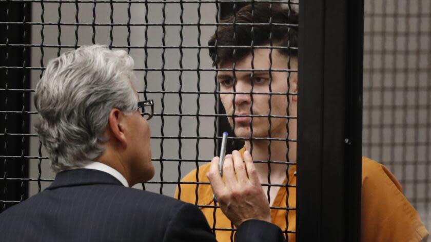 SANTA ANA CA JANUARY 17, 2018 -- Samuel Lincoln Woodward speaks with his attorney during his arraignment on murder charges in the death of Blaze Bernstein in Santa Ana on Wednesday, January 17, 2018. (Allen J. Schaben / Los Angeles Times)