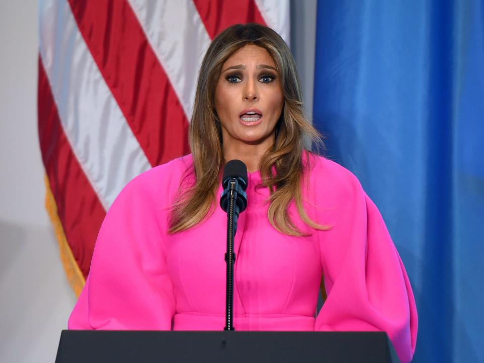 Melania Trump wears a bright pink dress with voluminous while speaking at the UN