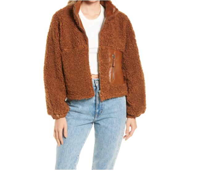 Model wears BlankNYC Faux Shearling with Faux Leather Trim Bomber Jacket in brown