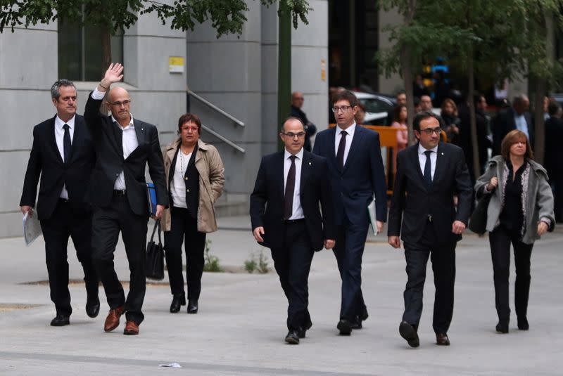 FILE PHOTO: Dismissed Catalan Foreign Affairs chief Raul Romeva waves as he arrives to Spain's High Court after being summoned to testify on charges of rebellion, sedition and misuse of public funds in Madrid